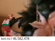 A delightful Christmas Train Set featuring Santa placed enchantingly beneath the Tree. Редакционное фото, фотограф Дмитрий Модестов / Фотобанк Лори