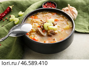Композиция с вкусным говяжьим ячменным супом на фоне гранж. Стоковое фото, фотограф Pixel_shot / Фотобанк Лори
