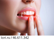 Young woman suffering from herpes on lips, health problems concept. Стоковое AI-изображение, AI-художник Станислав Тарко / Фотобанк Лори