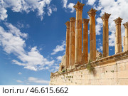 Temple of Zeus, Jordanian city of Jerash (Gerasa of Antiquity), capital and largest city of Jerash Governorate, Jordan. Against the background of a beautiful sky with clouds (2016 год). Стоковое фото, фотограф Владимир Журавлев / Фотобанк Лори