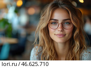 A young woman with natural beauty, a charming smile and expressive green eyes. She wears stylish round glasses with a thin gold frame, which emphasize her intellectual and modern image. She has long, slightly wavy light-brown hair, which gives her appearance lightness and ease.The background is slightly blurred, creating a feeling of coziness and a modern city cafe or coworking. Warm lighting adds softness to the photo, emphasizing the natural features of the girl's face. Her gaze is calm and friendly, creating an atmosphere of comfort and openness. Стоковое AI-изображение, AI-художник Анна Кривицкая / Фотобанк Лори