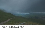 Moving dramatic clouds in mountains. Стоковое видео, видеограф Михаил Коханчиков / Фотобанк Лори