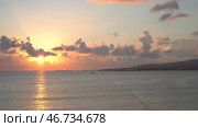 Gentle sunset with passing clouds over horizon with sea. Стоковое фото, фотограф David Kashakhi / Фотобанк Лори