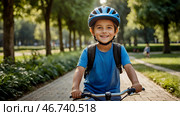 A cheerful little boy rides a bicycle in a helmet outdoors. A happy child is engaged in an active sport. Protection. Life insurance and child safety. Стоковое AI-изображение, AI-художник Photojuli / Фотобанк Лори