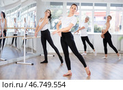 Group of slender women of different ages are learning various dance and ballet movements in studio. Стоковое фото, фотограф Яков Филимонов / Фотобанк Лори