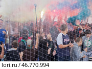 Russia, Samara. 30. 08. 2015. active young football fans at the stadium. Text in Russian: Samara Krylya Sovetov. Редакционное фото, фотограф Акиньшин Владимир / Фотобанк Лори