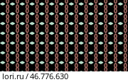 Abstract ovals and rhombuses arranged symmetrically in rows blinking on black background, seamless loop, motion graphics. Стоковая иллюстрация, иллюстратор David Kashakhi / Фотобанк Лори