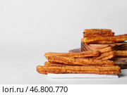 Доски с вкусными чуррос на белом фоне. Стоковое фото, фотограф Pixel_shot / Фотобанк Лори