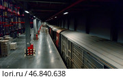 Busy work. Creative. Unloading trains with goods and placing them on special warehouse shelves. Стоковое фото, фотограф Данил Руденко / Фотобанк Лори