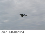 Лёгкий пассажирский самолёт АН-2, полёт под облаками. Волгоградская область, Средняя Ахтуба, Россия. (2022 год). Редакционное фото, фотограф Андрей Цыганков / Фотобанк Лори