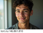 A young Brazilian man stands confidently, showcasing a natural smile against a minimalist backdrop. His relaxed expression highlights a sense of approachability. Стоковое AI-изображение, AI-художник Юлия Петровская / Фотобанк Лори