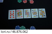 Player collected The Royal Flush on a green poker table against black. Стоковое фото, фотограф David Kashakhi / Фотобанк Лори