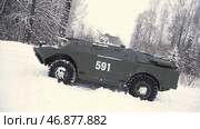 Soldier throws a hand grenade into a battle tank or armored personnel carrier, winter backround, Soldier throws a training grenade into a tank in the winter forest. Стоковая иллюстрация, иллюстратор David Kashakhi / Фотобанк Лори