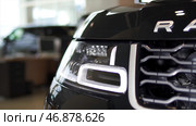 Exterior detail, headlight of a prestigious vehicle, luxury concept. Стоковое фото, фотограф David Kashakhi / Фотобанк Лори