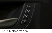 Close up for the side door buttons of a modern luxury car interior. Редакционное фото, фотограф David Kashakhi / Фотобанк Лори