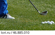 Golfer Hitting Golf Shot with Club on the Course. Стоковое фото, фотограф David Kashakhi / Фотобанк Лори