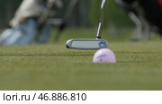 Golfer Hitting Golf Shot with Club on the Course. Стоковое фото, фотограф David Kashakhi / Фотобанк Лори