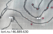 Aerial view of the karting track with moving small red karts, race and motorsport concept. Стоковое фото, фотограф David Kashakhi / Фотобанк Лори