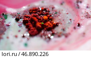 Fantastic colorful texture of ink stains in chaotic motion on white background. Стоковое фото, фотограф David Kashakhi / Фотобанк Лори