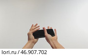 Hands Catching Falling Smartphone Mid-Air. Стоковое видео, видеограф Илья Шаматура / Фотобанк Лори