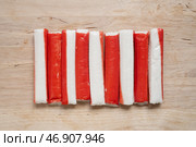Палочки из крабового мяса на деревянной доске. Стоковое фото, фотограф Дорощенко Элла / Фотобанк Лори