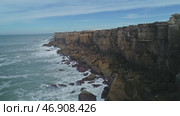 Atlantic coast with rock cliffs and waves. Стоковое видео, видеограф Михаил Коханчиков / Фотобанк Лори