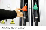 Media.Cylinders with gasoline and gas are taken and then put in place for refueling the car. Стоковое фото, фотограф David Kashakhi / Фотобанк Лори
