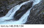 Beautiful bubbling waterfall water in stream on rocky terrain. Стоковое фото, фотограф David Kashakhi / Фотобанк Лори