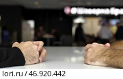 Negotiation of two men with their hands showing gestures and emotions. Стоковое фото, фотограф David Kashakhi / Фотобанк Лори