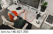 Esports enthusiast practicing gaming strategy. Focused girl in headset plays computer game using precision mouse and white keyboard. High-speed response and accuracy improve performance in matches. Стоковое видео, видеограф Енваев Андрей / Фотобанк Лори