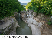A picturesque natural corridor in a limestone formation laid by the course of the Belaya River - Khadzhokhskaya Gorge (Kamennomost Canyon) on a summer day, Kamennomostsky, Republic of Adygea, Russia. Стоковое фото, фотограф Ula Ulachka / Фотобанк Лори