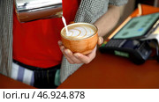 Skill baristas masterfully create drawings on cappuccino is called pitching. Стоковое фото, фотограф David Kashakhi / Фотобанк Лори