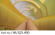 Woman with yellow fun slides water slides. Стоковое фото, фотограф David Kashakhi / Фотобанк Лори