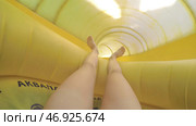 Woman with yellow fun slides water slides. Стоковое фото, фотограф David Kashakhi / Фотобанк Лори