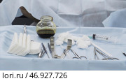 Close up of medical tools, iodine cup and white cotton balls and sterile gauze, concept of medicine. Стоковое фото, фотограф David Kashakhi / Фотобанк Лори
