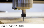 Milling machine with CNC cutting the wooden workpiece. Стоковое фото, фотограф David Kashakhi / Фотобанк Лори