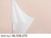 Белый флаг на светлом фоне. Стоковое фото, фотограф Pixel_shot / Фотобанк Лори