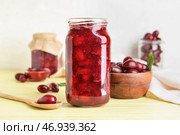 Баночка вкусного варенья из кизила и ягод на столе. Стоковое фото, фотограф Pixel_shot / Фотобанк Лори