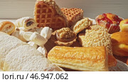 Delightful assortment of traditional sweets showcased in vibrant sunlight at a local bakery. Стоковое видео, видеограф Сергей Толмачёв / Фотобанк Лори