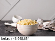 Чаша с вкусным кускусом на столе. Стоковое фото, фотограф Pixel_shot / Фотобанк Лори