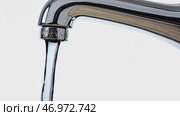 Sink faucet dripping with the water drop. A drop of water drips from a leaky faucet. Bathroom metal tap isolated on transparent white background with Falling water drop close up. Droplet. Copy space. Стоковое AI-видео, аниматор Марина Демидюк / Фотобанк Лори
