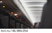 The warning light in the passenger cabin lights up, warning of seat belt fastening. Flight safety rules and procedures. Стоковое видео, видеограф Darya Komarova / Фотобанк Лори