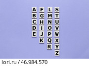 Буквы на фиолетовом фоне. Концепция алфавита. Стоковое фото, фотограф Pixel_shot / Фотобанк Лори