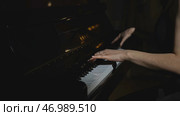 Elegant woman plays piano in accelerated rhythm. Стоковое фото, фотограф David Kashakhi / Фотобанк Лори