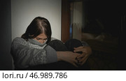 Woman with psychological illness or disorder alone at home. Стоковое фото, фотограф David Kashakhi / Фотобанк Лори