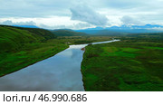 Aerial view of summer green meadow and long narrow river. Стоковое фото, фотограф David Kashakhi / Фотобанк Лори