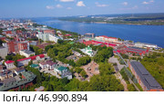 Aerial view of a summer city located along the wide river. Стоковое фото, фотограф David Kashakhi / Фотобанк Лори