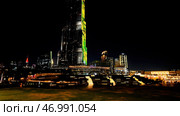 Dubai, United Arab Emirates - December 12, 2023: Burj Khalifa tallest building at night. Редакционное фото, фотограф David Kashakhi / Фотобанк Лори