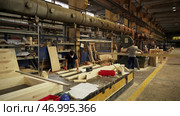 Join us for an engaging Woodworking Workshop featuring skilled Craftsmen and specialized Equipment. Стоковое фото, фотограф David Kashakhi / Фотобанк Лори