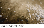 Extracted pile of mineral releases steam on winter day at quarry. Стоковое фото, фотограф David Kashakhi / Фотобанк Лори
